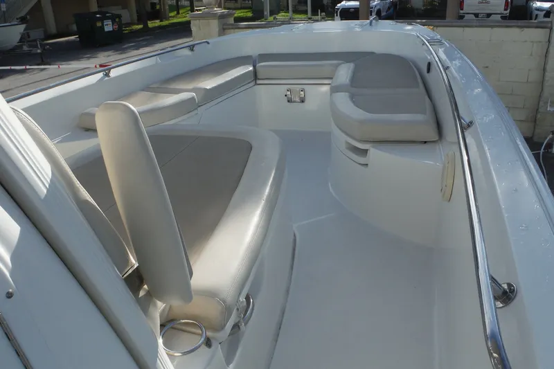 Slide: The Image of 2020 Boston Whaler 270 Dauntless boat interior with cushioned seating and stainless steel railings. - 41