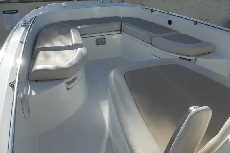 Slide: The Image of 2020 Boston Whaler 270 Dauntless boat interior with cushioned seating. - 34