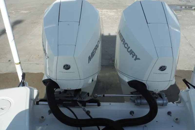 Slide: The Image of Twin Mercury outboard engines on a 2020 Boston Whaler 270 Dauntless boat. - 37