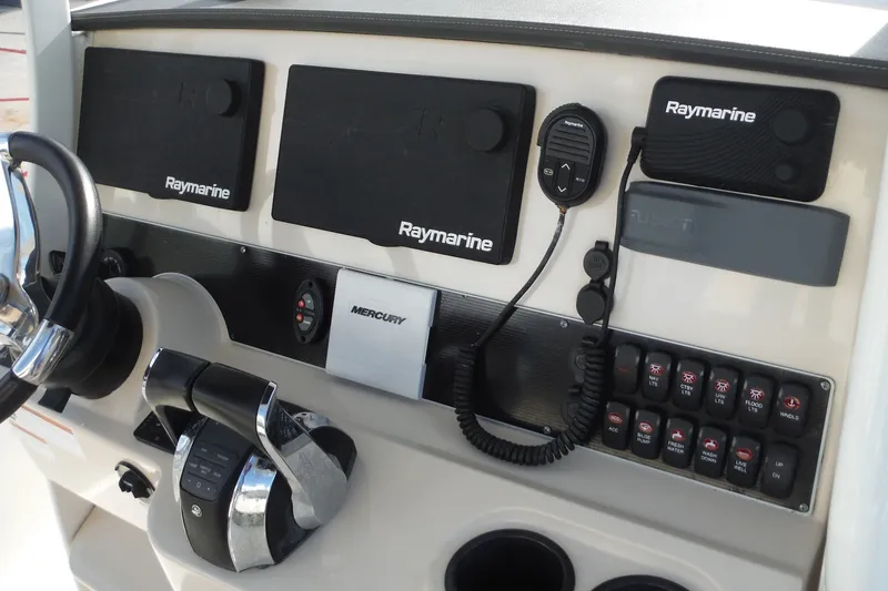 Slide: The Image of Control panel of 2020 Boston Whaler 270 Dauntless with Raymarine electronics and Mercury controls. - 31