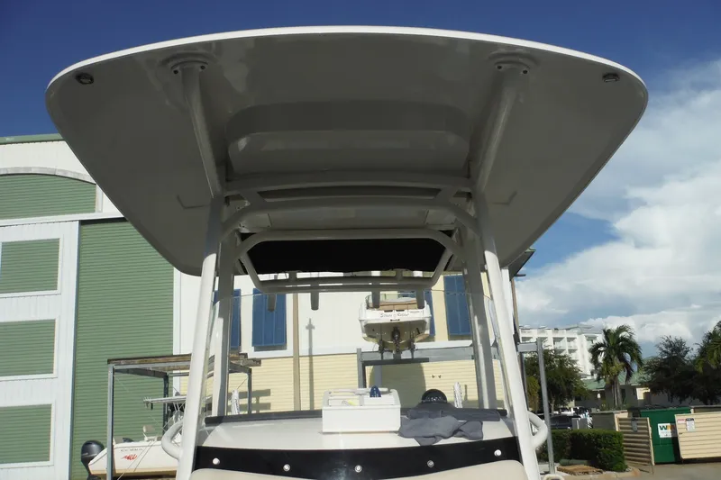 Slide: The Image of 2020 Boston Whaler 270 Dauntless boat with T-top, docked outdoors. - 35