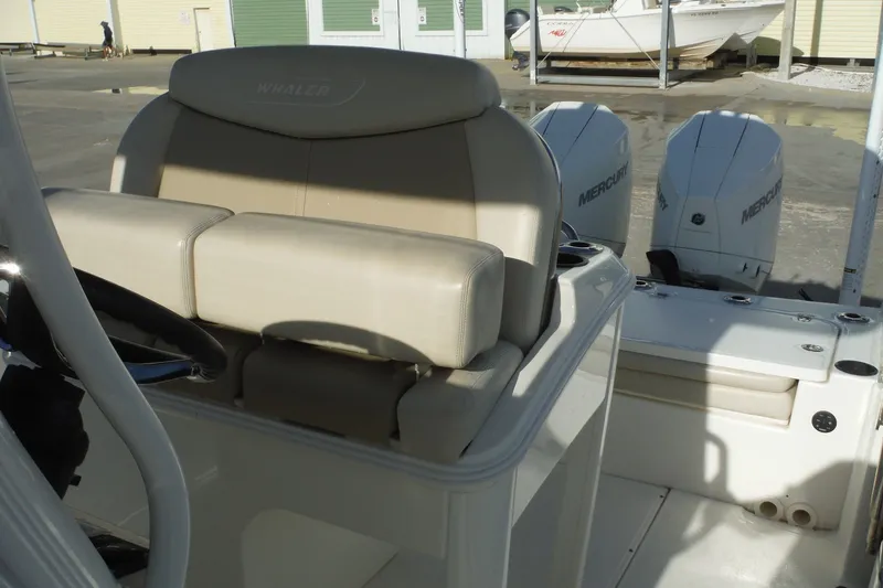 Slide: The Image of 2020 Boston Whaler 270 Dauntless boat interior with dual Mercury engines. - 27