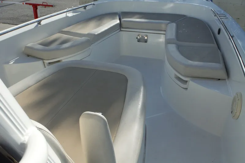 Slide: The Image of 2020 Boston Whaler 270 Dauntless boat interior with cushioned seating. - 20