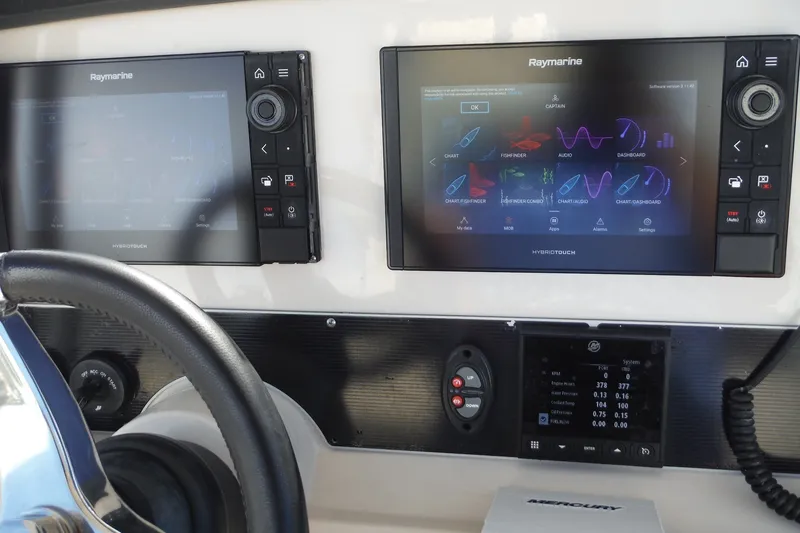 Slide: The Image of Dashboard of a 2020 Boston Whaler 270 Dauntless with Raymarine displays and controls. - 30