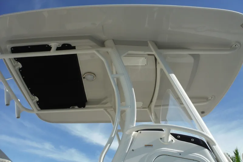 Slide: The Image of Boston Whaler 270 Dauntless 2020 T-top structure against blue sky. - 14