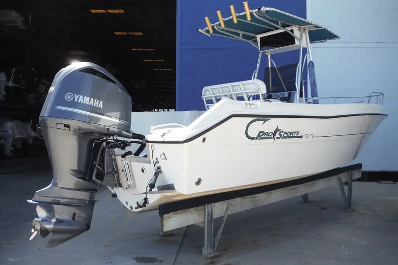 Slide: The Image of 1999 Pro Sports 2200 CC boat with Yamaha outboard motor on a stand. - 5