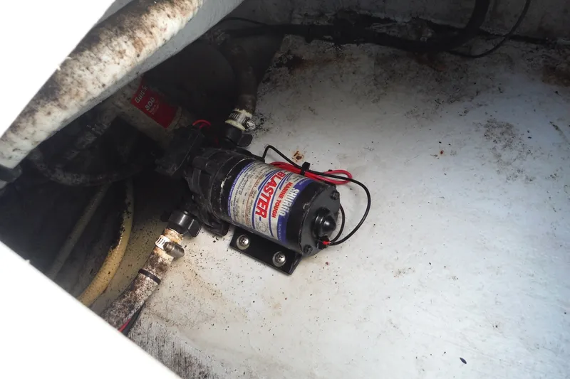 Slide: The Image of Bilge pump installation in a 1999 Pro Sports 2200 CC boat. - 26