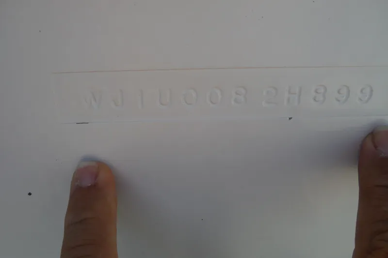 Slide: The Image of VIN number embossed on a 1999 Pro Sports 2200 CC boat hull. - 30