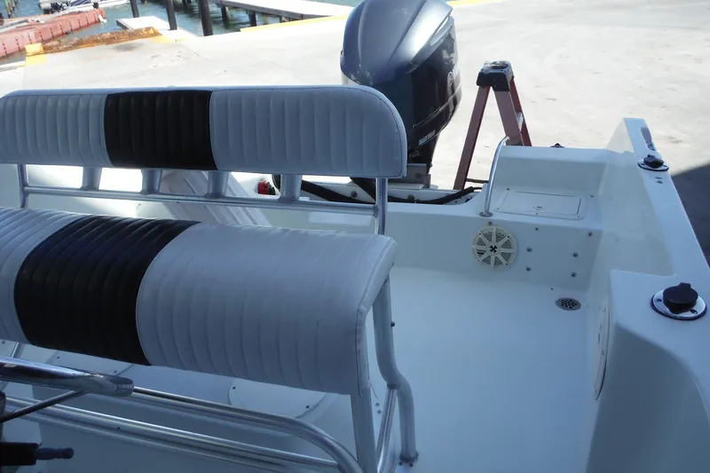 Slide: The Image of 1999 Pro Sports 2200 CC boat interior with seating and outboard motor. - 9