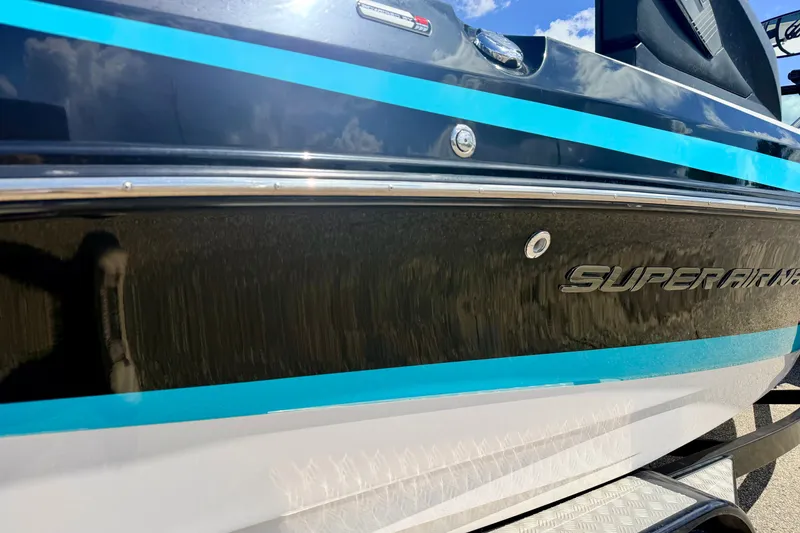 Slide: The Image of 2014 Nautique Super Air Nautique 210 boat with blue accents and sleek design. - 15