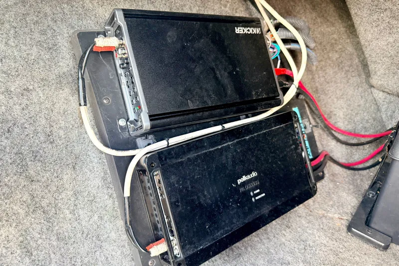 Slide: The Image of Audio amplifiers in a 2014 Nautique Super Air Nautique 210 boat. - 50