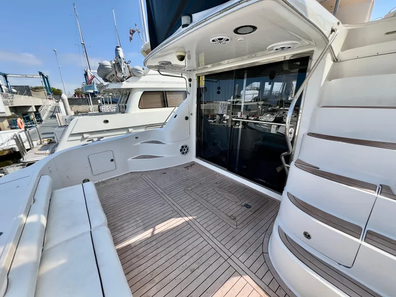 Slide: The Image of 2002 Sea Ray 560 Sedan Bridge yacht with spacious deck and elegant design. - 17