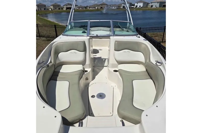 Slide: The Image of 2006 Sea Ray 220 Sundeck boat interior with spacious seating and lake view. - 4