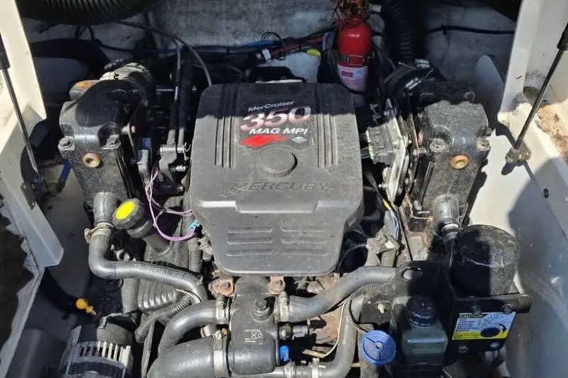 Slide: The Image of Engine compartment of a 2006 Sea Ray 220 Sundeck with MerCruiser 350 MAG MPI engine. - 12