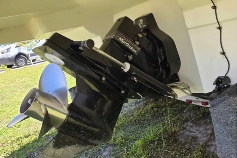 Slide: The Image of Outboard motor of a 2006 Sea Ray 220 Sundeck boat, featuring a MerCruiser engine. - 6