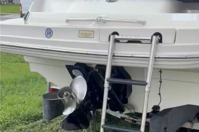 Slide: The Image of Rear view of a 2006 Sea Ray 220 Sundeck boat with ladder and propeller. - 7