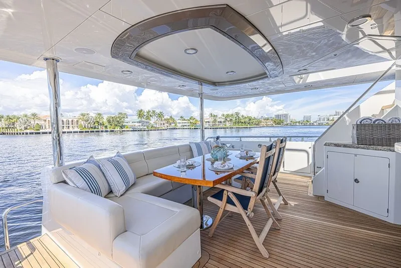 Slide: The Image of Luxurious 2018 Ocean Alexander 85 E yacht deck with elegant seating and waterfront view. - 6