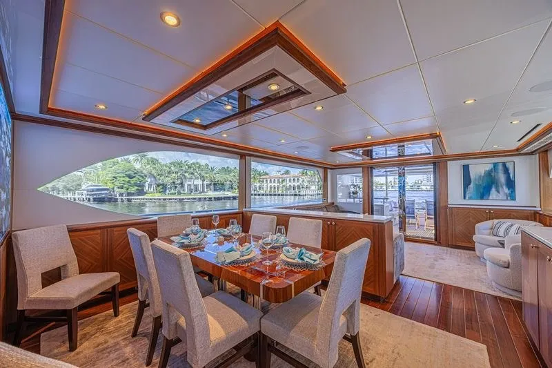 Slide: The Image of Luxurious dining area on 2018 Ocean Alexander 85 E yacht with elegant decor and waterfront views. - 22