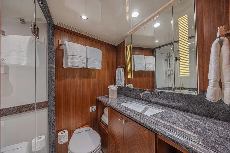 Slide: The Image of Luxurious bathroom in 2018 Ocean Alexander 85 E yacht with wood accents and modern fixtures. - 40