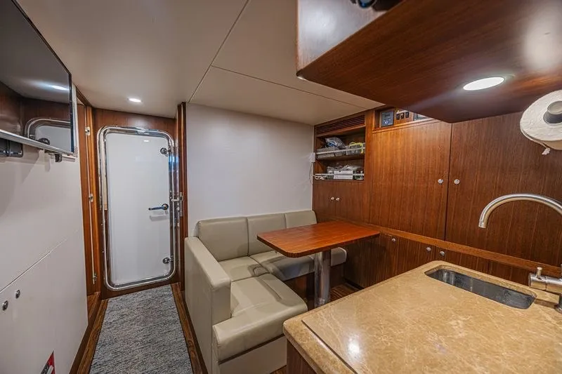 Slide: The Image of Luxurious interior of 2018 Ocean Alexander 85 E yacht with seating and kitchenette. - 39