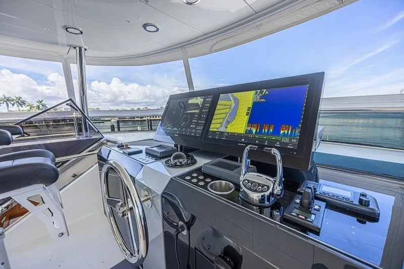 Slide: The Image of Modern helm station of 2018 Ocean Alexander 85 E yacht with advanced navigation displays. - 18