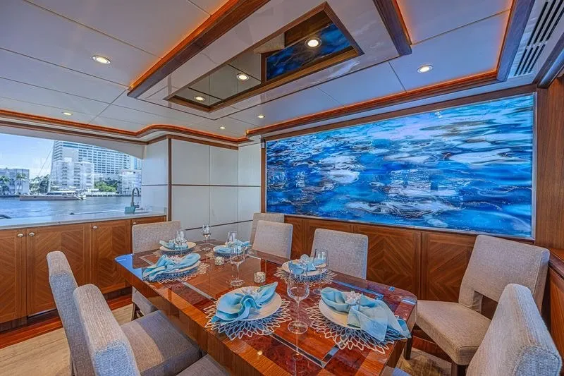 Slide: The Image of Luxurious dining area on 2018 Ocean Alexander 85 E yacht with elegant table setting. - 21