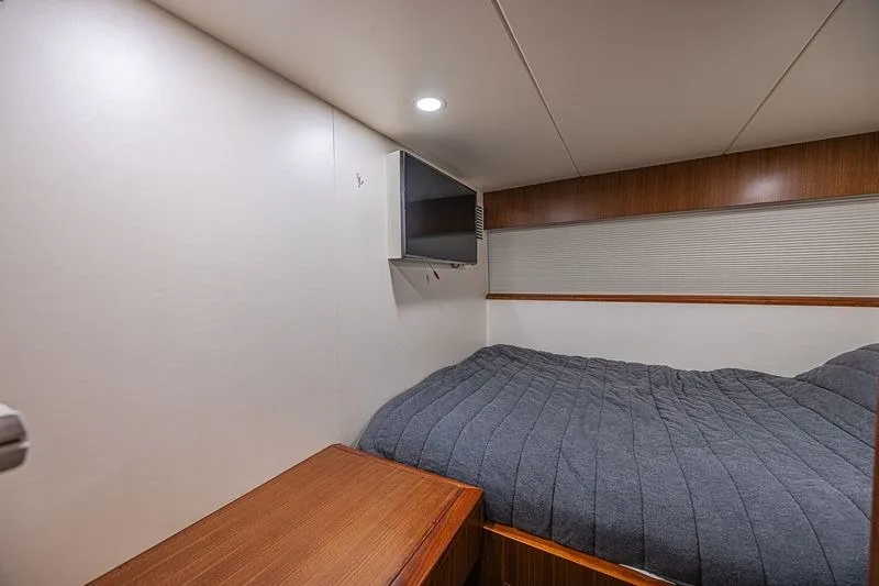 Slide: The Image of Cozy bedroom in 2018 Ocean Alexander 85 E yacht with TV and wood accents. - 42