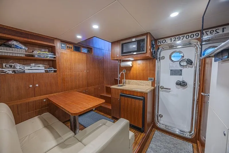 Slide: The Image of Luxurious interior of 2018 Ocean Alexander 85 E yacht with kitchenette and seating area. - 41