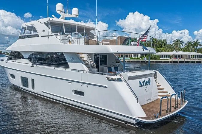 Slide: The Image of Luxury 2018 Ocean Alexander 85 E yacht on water, featuring sleek design and spacious deck. - 4