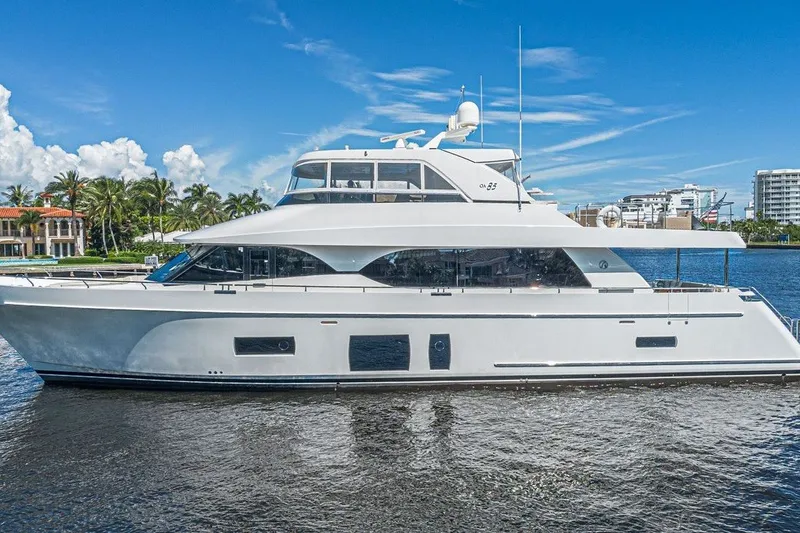 Slide: The Image of 2018 Ocean Alexander 85 E yacht on calm water, clear sky background. - 1