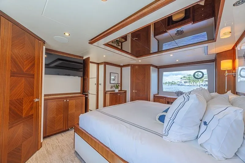 Slide: The Image of Luxurious bedroom interior of 2018 Ocean Alexander 85 E yacht with elegant wood finishes. - 27