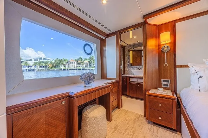 Slide: The Image of Luxurious interior of 2018 Ocean Alexander 85 E yacht with elegant wood finishes and waterfront view. - 28