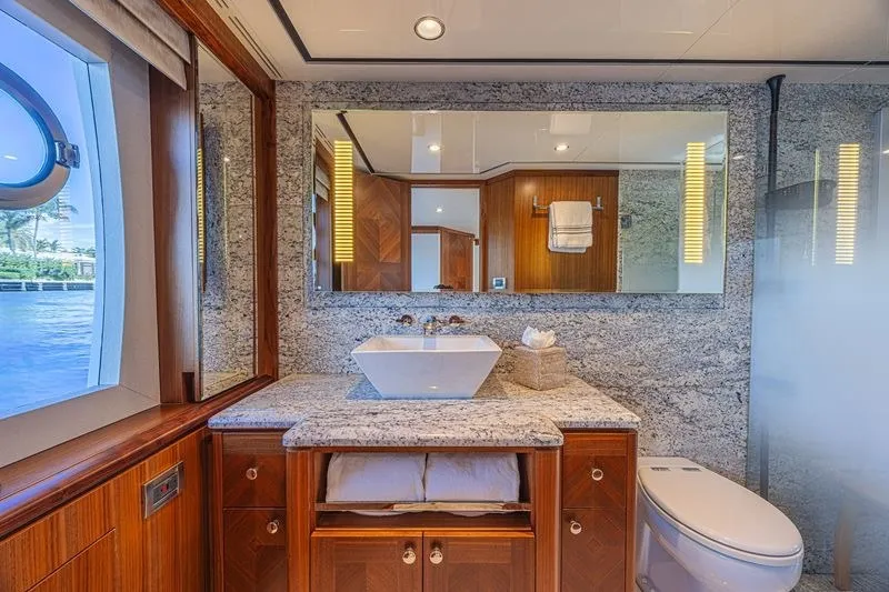 Slide: The Image of Luxurious bathroom on 2018 Ocean Alexander 85 E yacht with granite countertops and modern fixtures. - 30