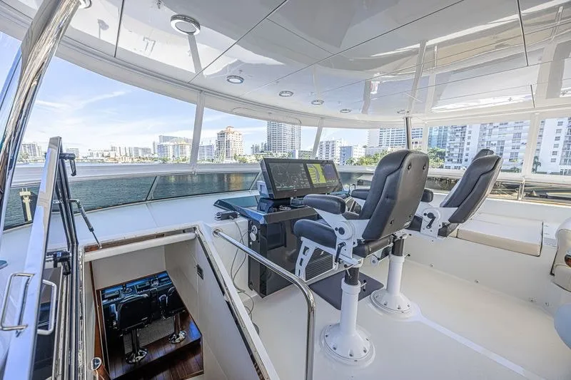 Slide: The Image of Luxurious helm of 2018 Ocean Alexander 85 E yacht with modern navigation equipment. - 17