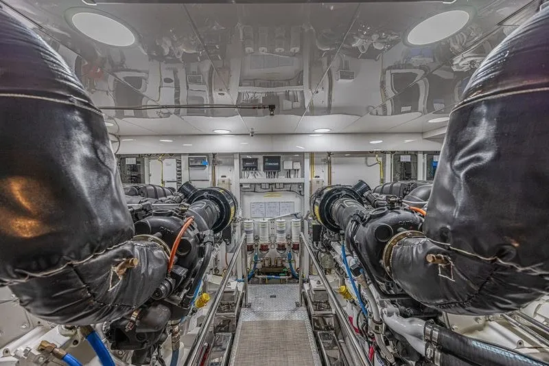 Slide: The Image of Engine room of 2018 Ocean Alexander 85 E yacht, showcasing dual engines and mechanical systems. - 46