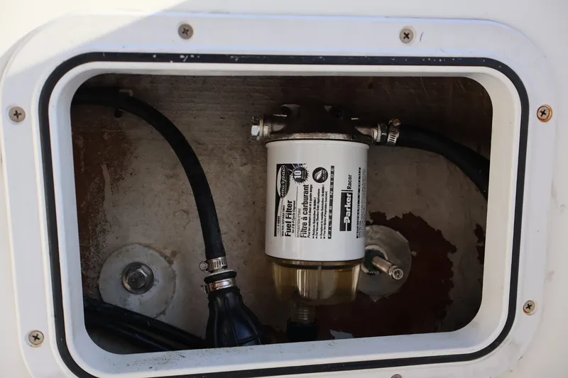 Slide: The Image of Fuel filter compartment in a 1989 Mako 231 Center Console boat. - 15