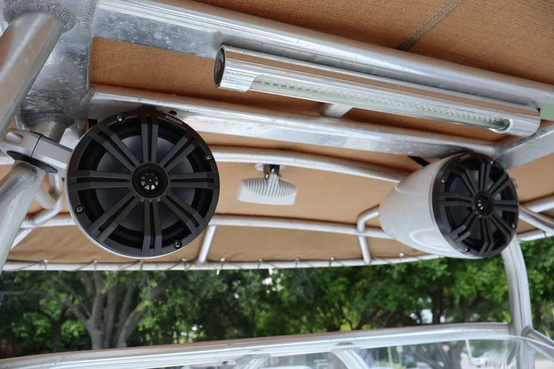 Slide: The Image of Speakers and light fixture on 1989 Mako 231 Center Console boat canopy. - 20