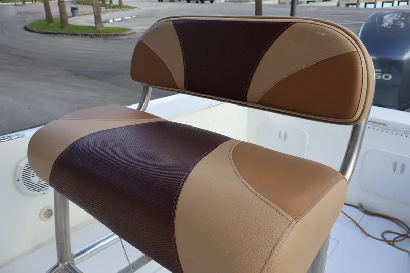 Slide: The Image of Brown and tan seat on 1989 Mako 231 Center Console boat. - 19
