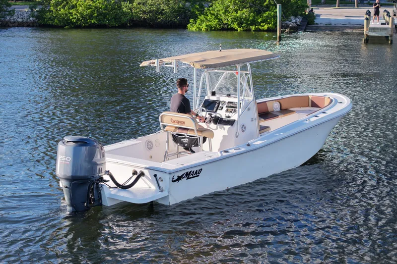 The Image of 1989 Mako 231 Center Console boat on water, featuring a 250 horsepower outboard motor. - 1