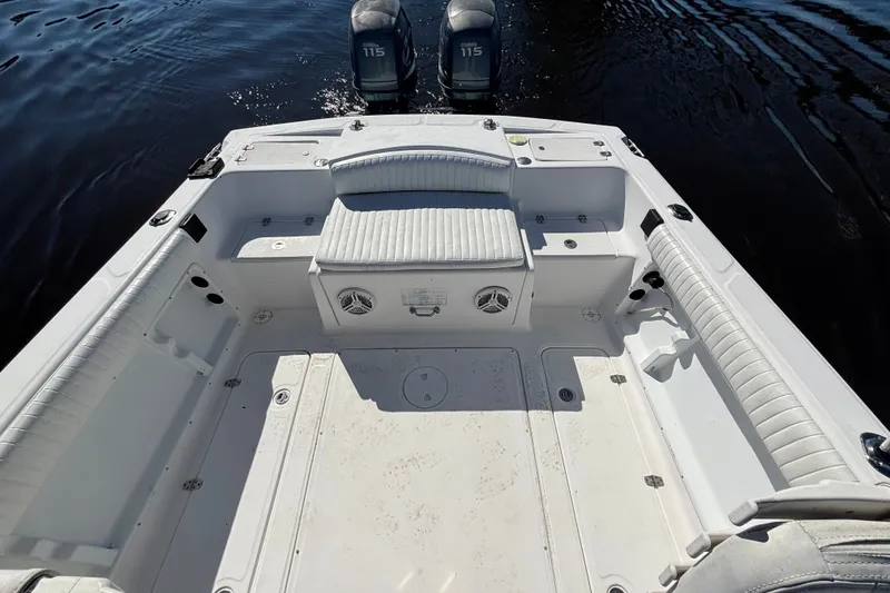 Slide: The Image of 2008 Angler 220WA boat interior with seating and twin Yamaha 115 engines. - 10