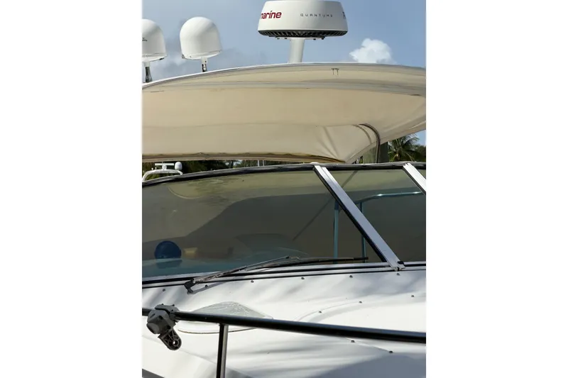 Slide: The Image of 2004 Cruisers Yachts 340 Express with radar equipment and canopy, close-up view. - 4
