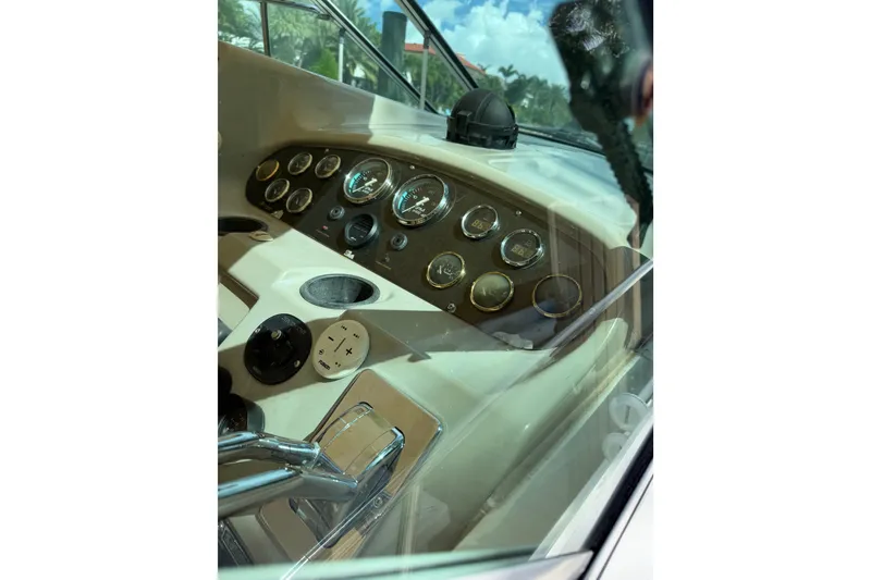 Slide: The Image of Dashboard of a 2004 Cruisers Yachts 340 Express with gauges and controls. - 8