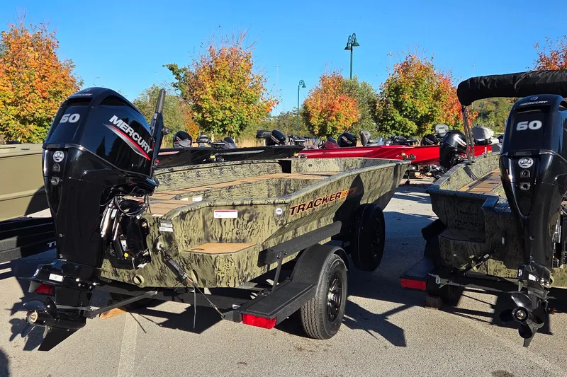 The Image of 2026 Tracker Grizzly 1756 T Marsh boat with Mercury 50 engine, parked outdoors. - 0