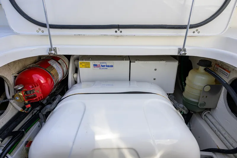Slide: The Image of Engine compartment of 2020 Pursuit S 368 Sport boat with fire extinguisher and equipment. - 29
