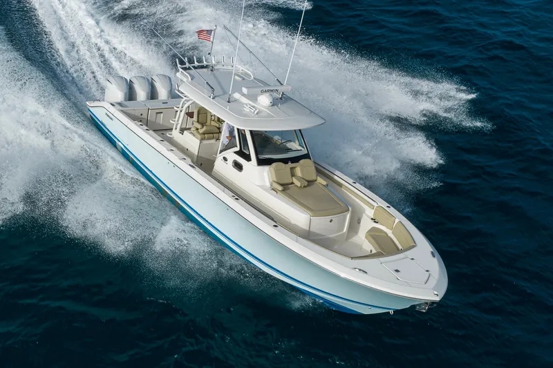 Slide: The Image of 2020 Pursuit S 368 Sport boat cruising on open water. - 45