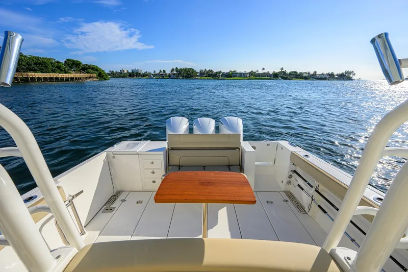 Slide: The Image of 2020 Pursuit S 368 Sport boat interior with ocean view and seating area. - 19