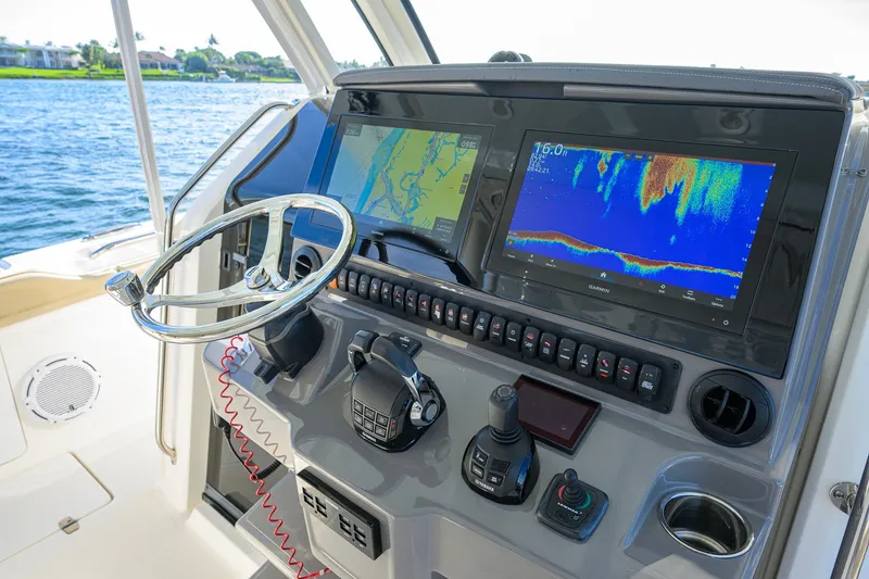 Slide: The Image of Helm of 2020 Pursuit S 368 Sport boat with advanced navigation displays. - 21