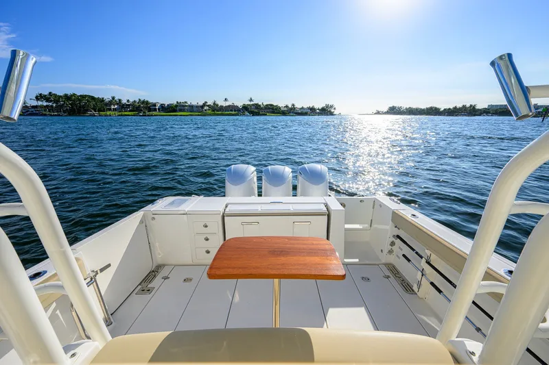 Slide: The Image of 2020 Pursuit S 368 Sport boat deck with ocean view and sunny sky. - 17