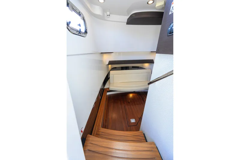 Slide: The Image of Interior view of 2020 Pursuit S 368 Sport boat with wooden flooring and seating area. - 30
