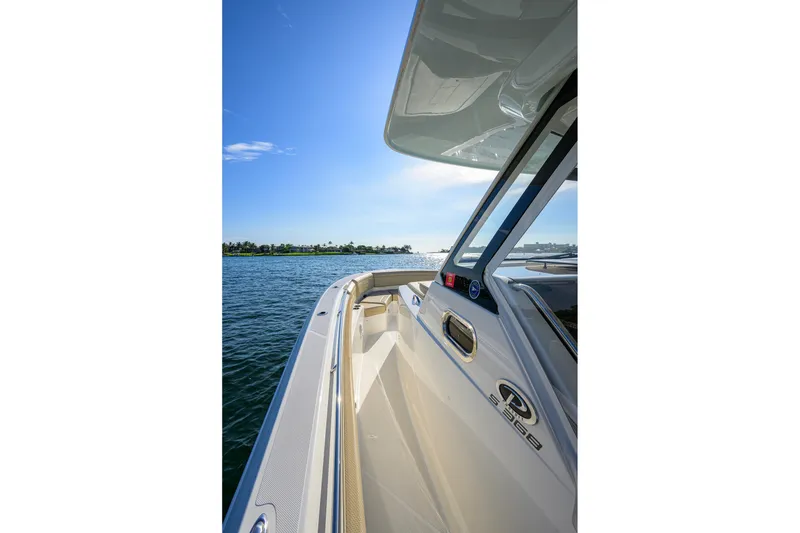 Slide: The Image of 2020 Pursuit S 368 Sport boat cruising on a sunny day. - 13